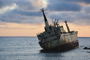rusty ship on sea