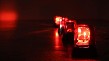 red alarms glowing in a dimly lit room