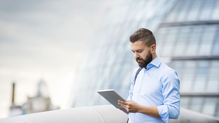 businessman looking at tablet