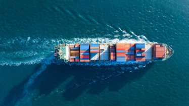 a ship with containers on the water