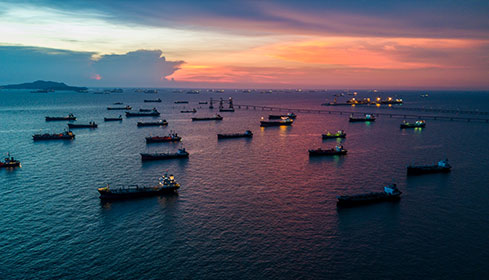 sunset vessels at sea